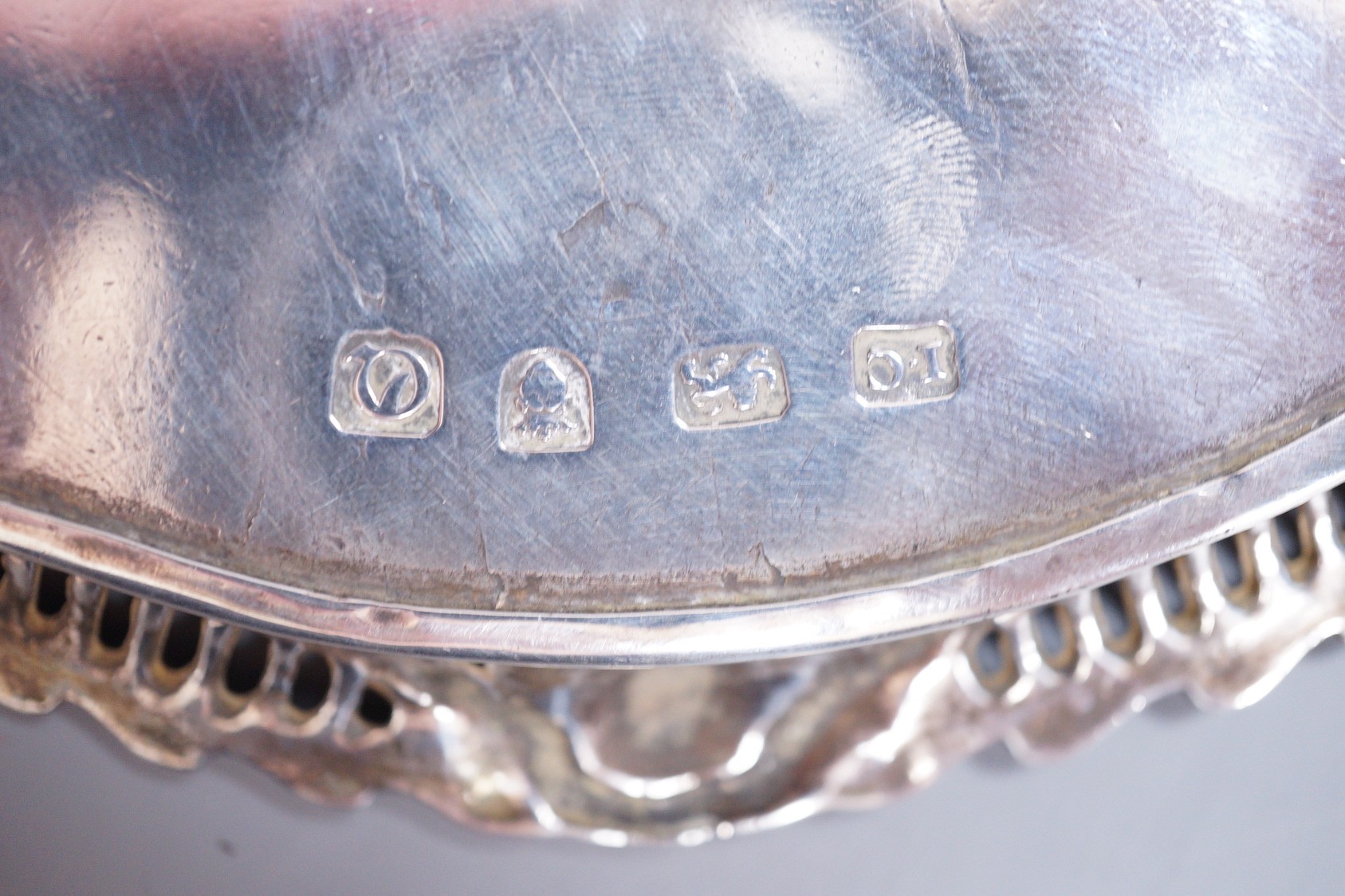 A George III silver waiter with applied pierced silver border, John Cox, London, 1771, 18.1cm, 11.9oz, with later engraved initials and date to the base, (a.f.).